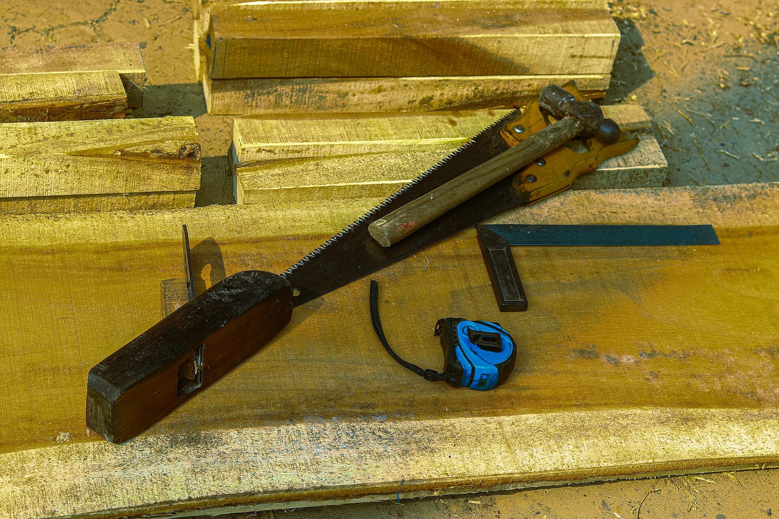 Hand tools arranged on timber planks